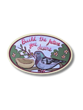 Oval-shaped sticker with a pigeon, nest, and motivational quote on a white background