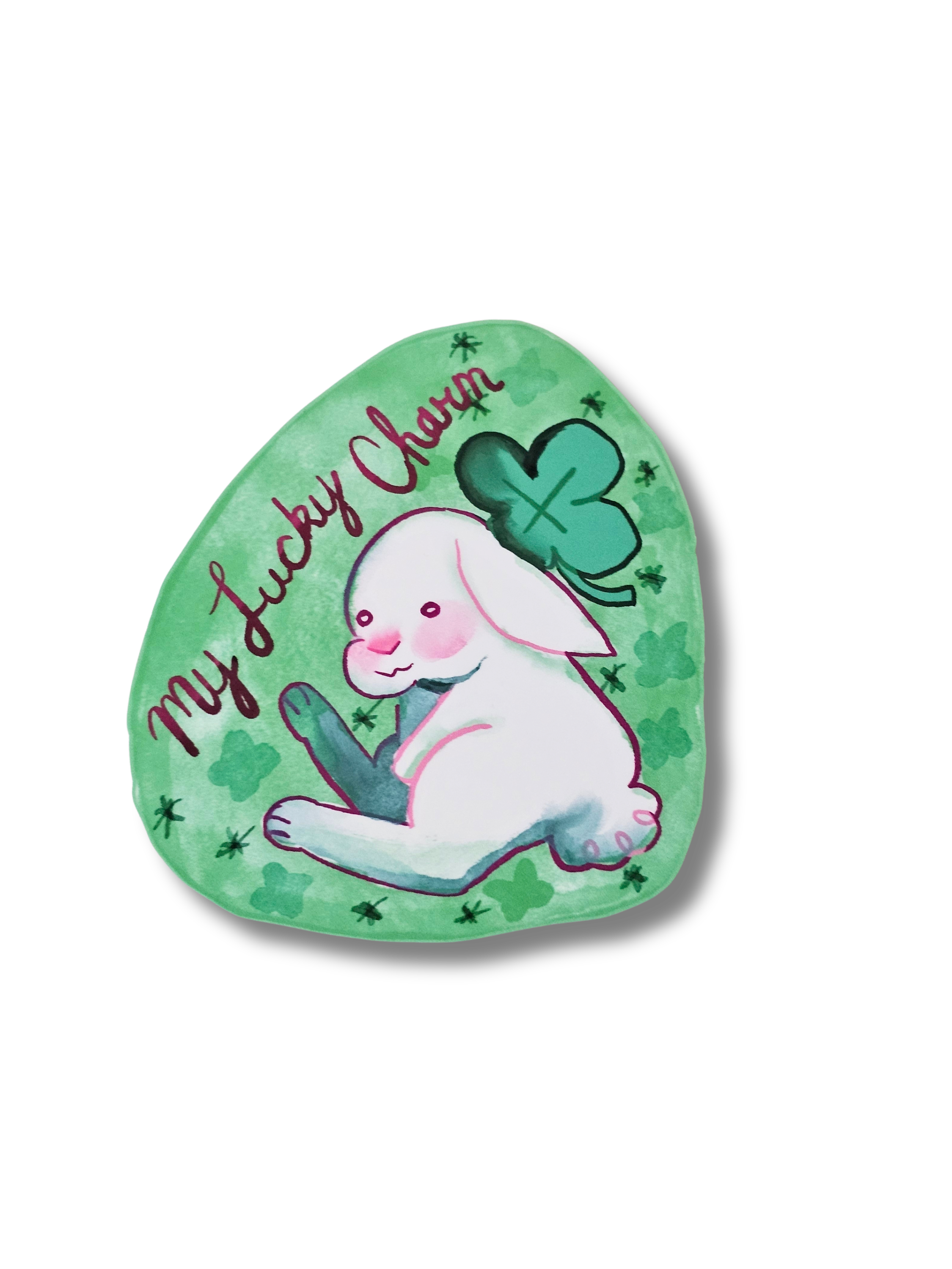 Green sticker with a rabbit and clover design and 'My Lucky Charm' text on a white background