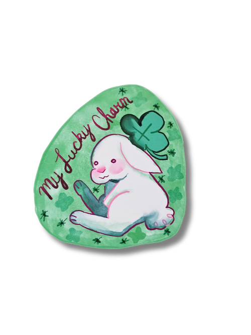 Green sticker with a rabbit and clover design and 'My Lucky Charm' text on a white background