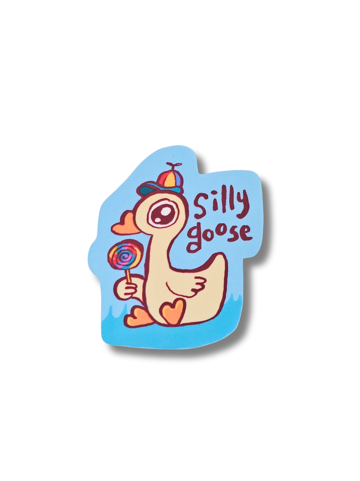 Sticker of a cartoon goose holding a lollipop with 'Silly goose' text on a white background