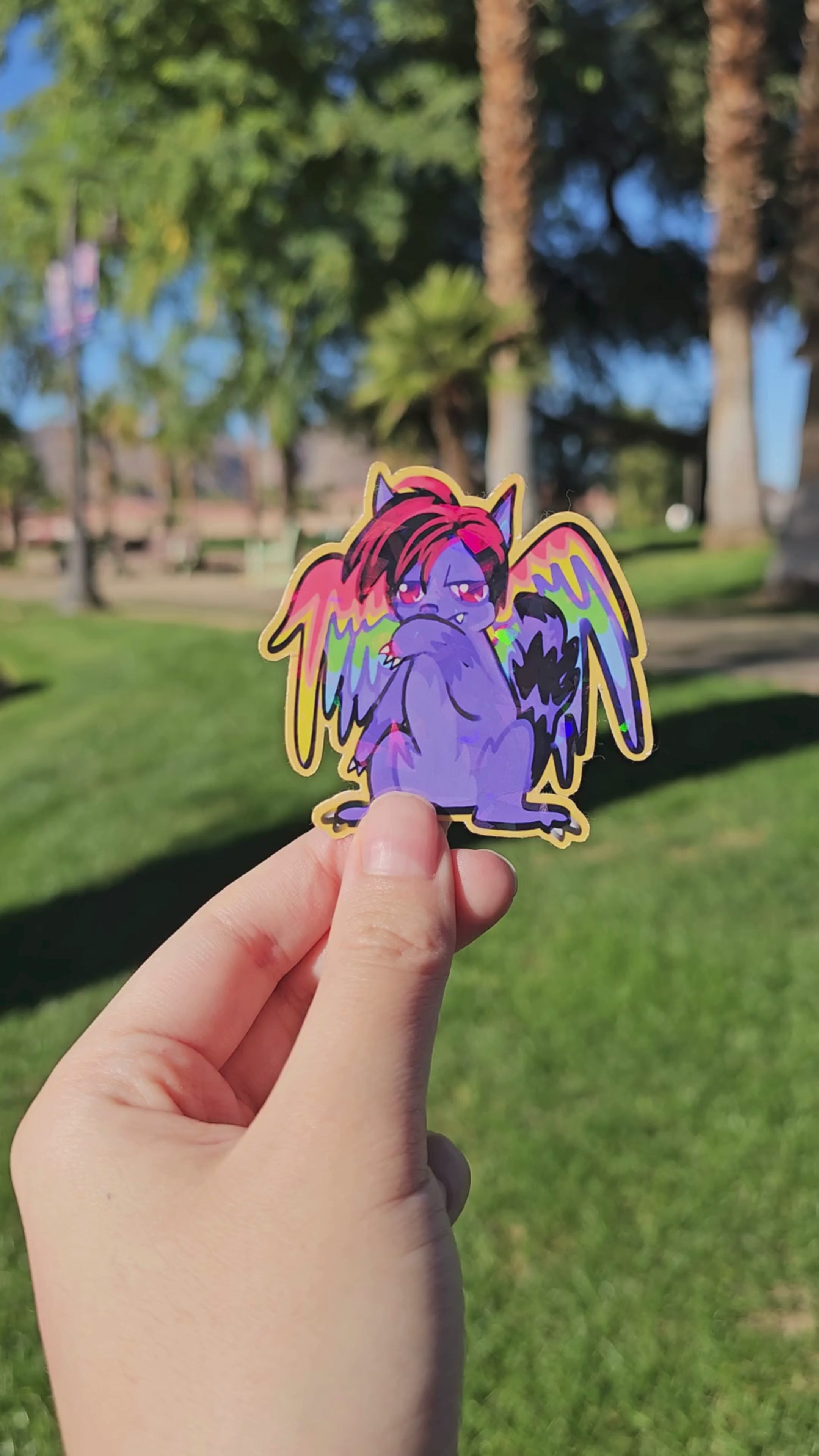 A muted video displaying the holographic finish of the Shinigami Eyes Cat die-cut sticker.
